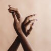Hands of a Black woman delicately raised in the air