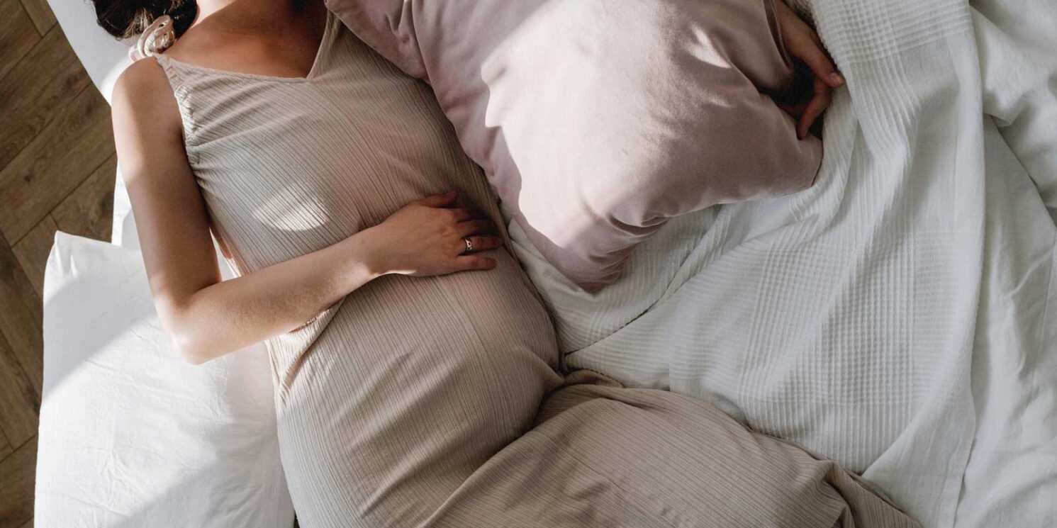 pregnant woman resting in bed