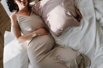 pregnant woman resting in bed