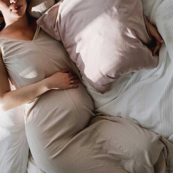 pregnant woman resting in bed