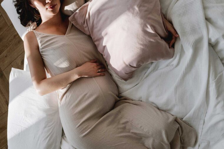 pregnant woman resting in bed